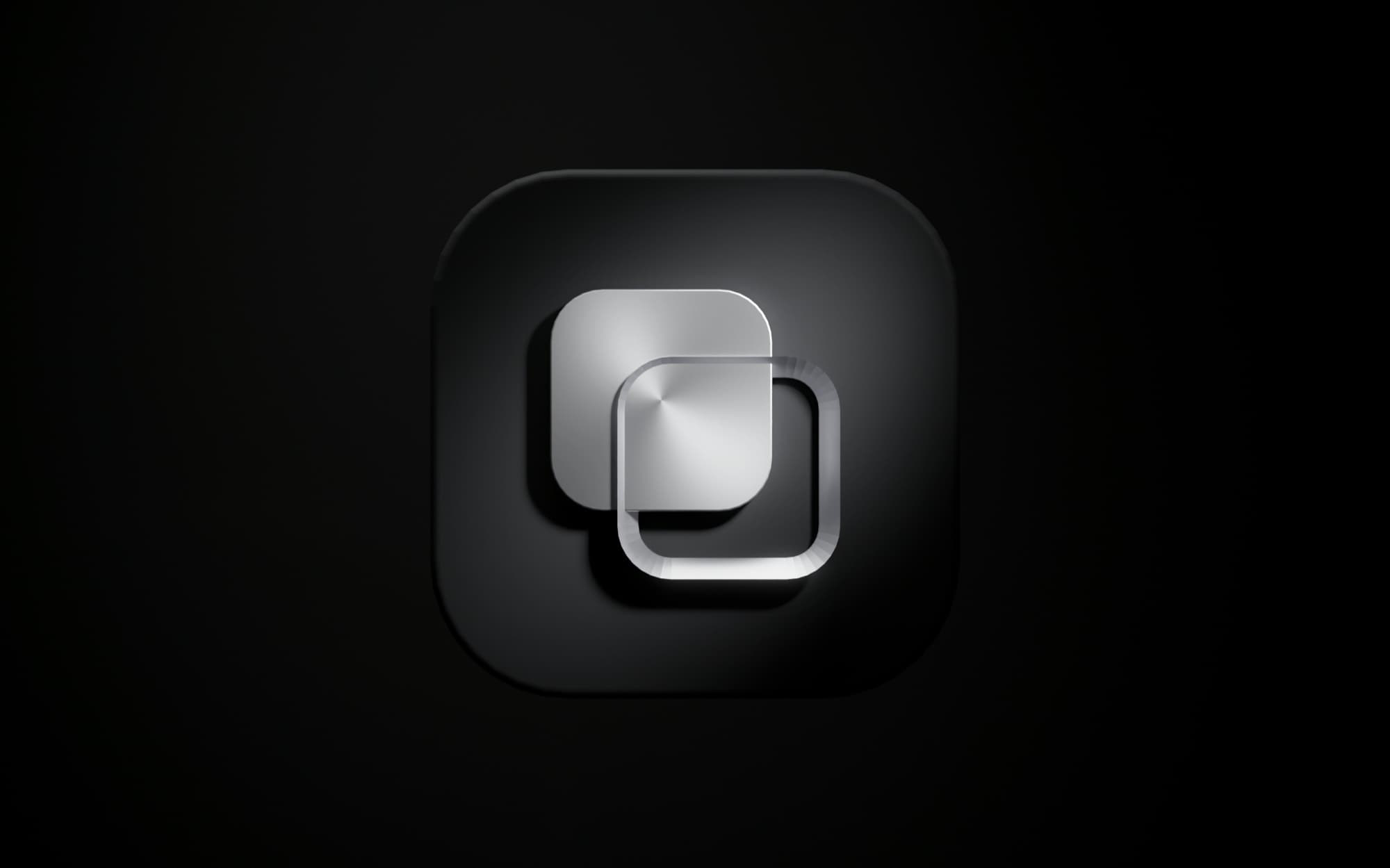 The Refactron symbol machined in brushed steel, floating on a matte black tile.
